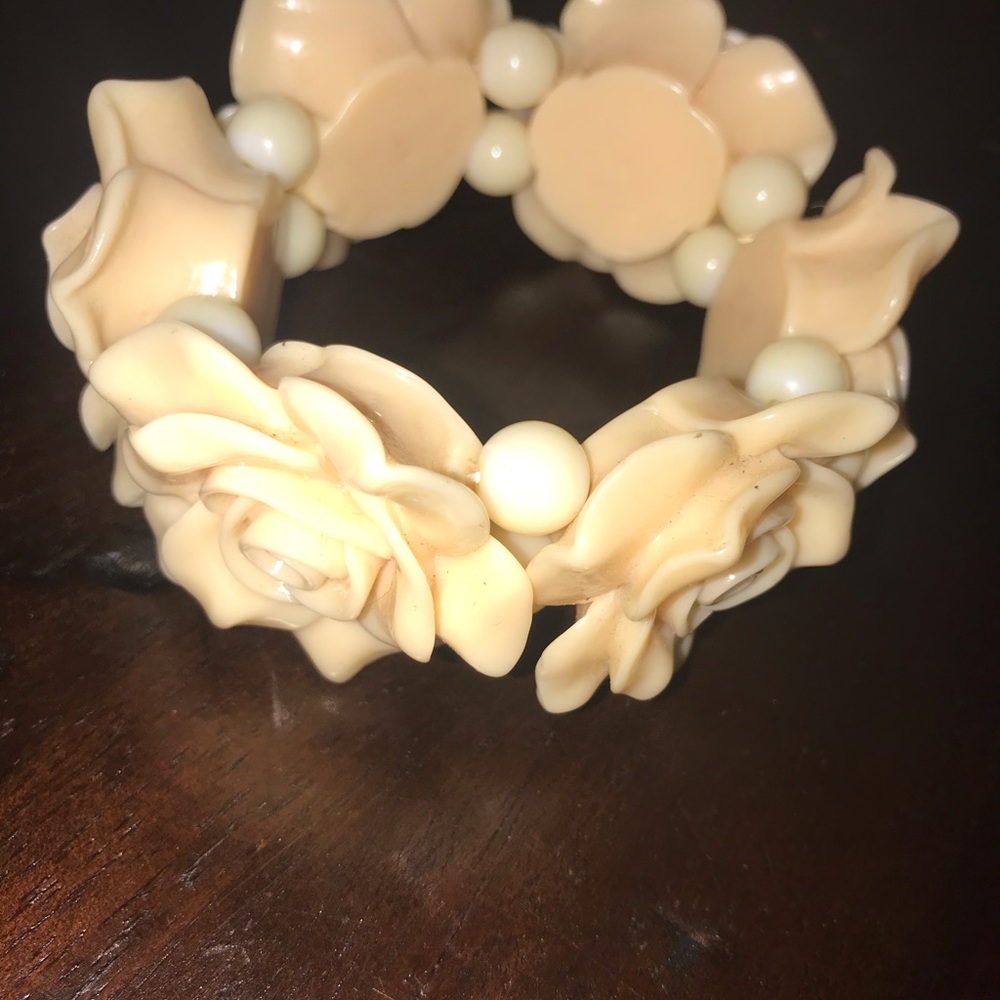 Cream colored plastic corsage bracelet